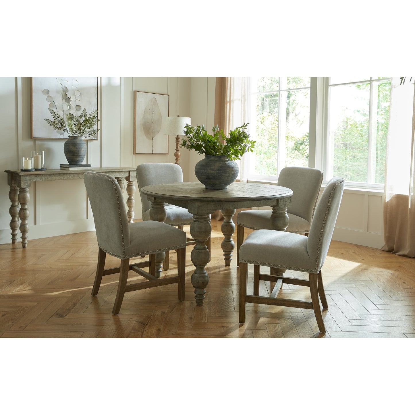 Brown wood Dine and Dwell St Ives round dining table with smooth surface and sturdy legs for family meals and gatherings.
