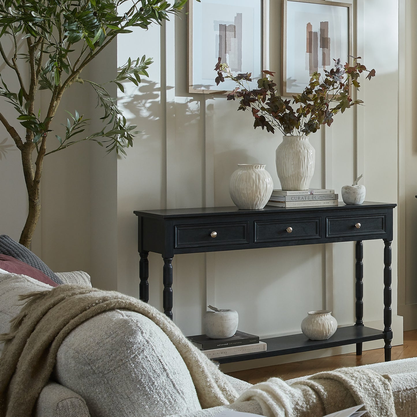 Black wood Dine and Dwell Bidbury sideboard with three drawers and sleek design, perfect for modern living spaces.