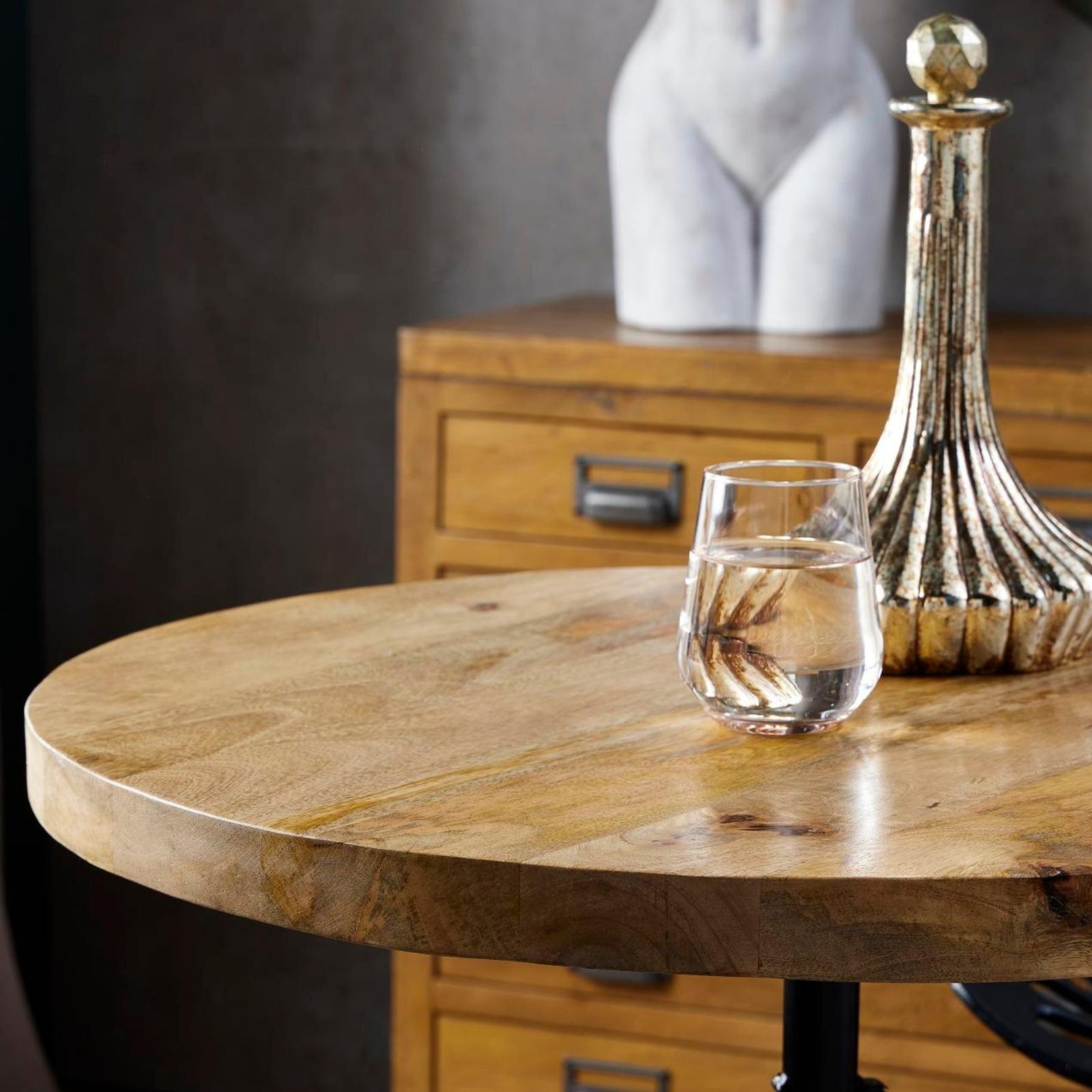 Dine and Dwell Norwich adjustable draftsman bar table with round brown wood top and black metal frame, ideal as an island table.