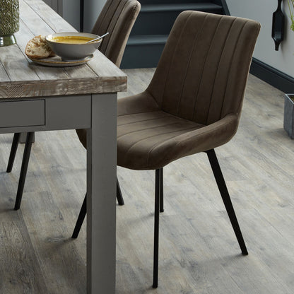 Wareham leather-effect fabric dining chair with channel stitching and black metal legs by Dine and Dwell.