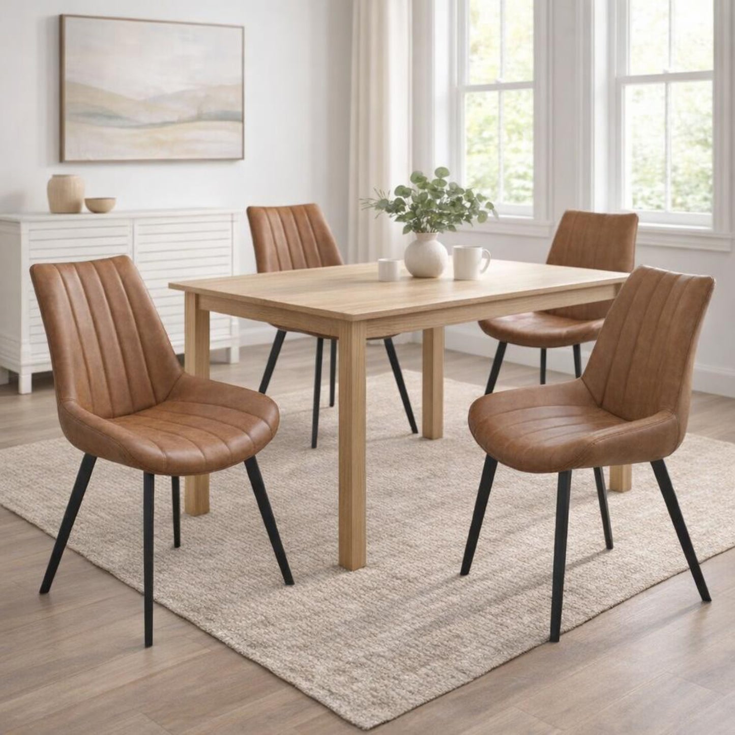 Wareham Tan Faux Leather Dining Chair with channel stitching and black metal legs from Dine and Dwell.