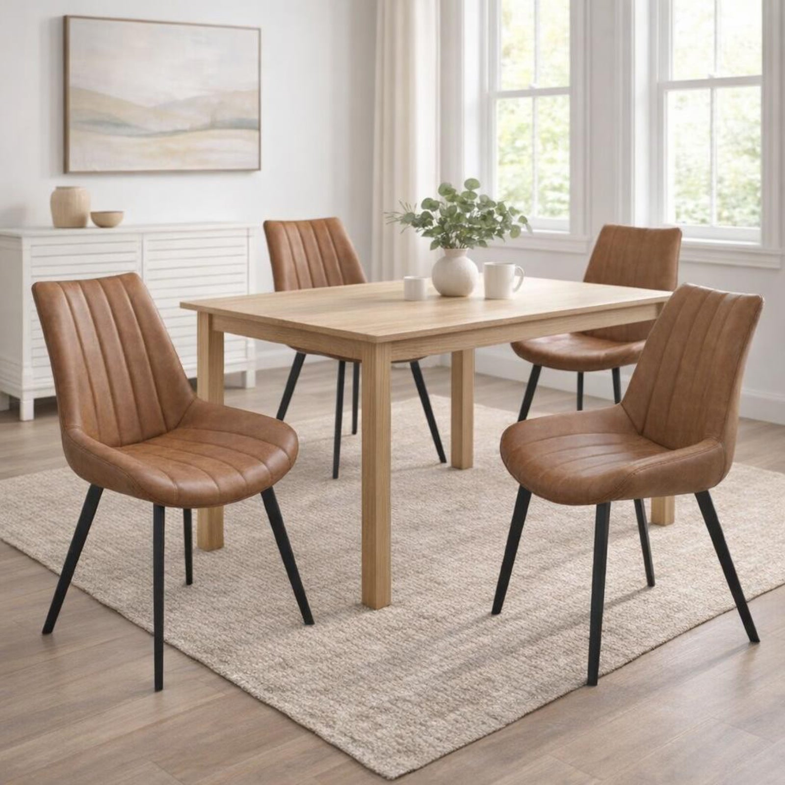 Wareham Tan Faux Leather Dining Chair with channel stitching and black metal legs from Dine and Dwell.