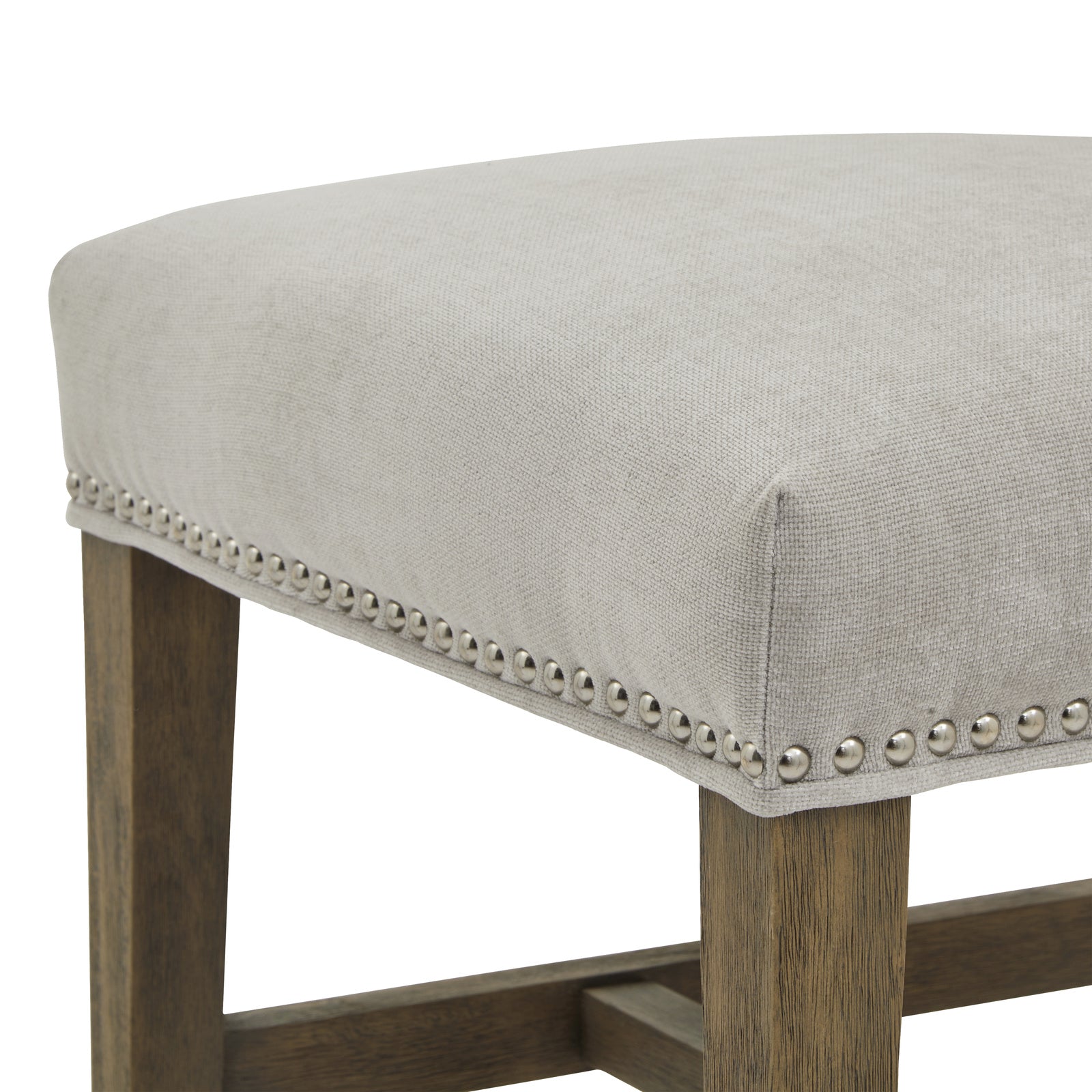 Winchester grey upholstered dining chair with oak frame and brass studding by Dine and Dwell, showcasing elegant craftsmanship and design