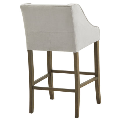 Dine and Dwell Liverpool grey upholstered fabric and wood bar stool with cushioned seat and modern design.