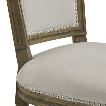 Grey upholstered Dine and Dwell Cambridge dining chair with wooden legs, showcasing a modern and comfortable dining room seat.
