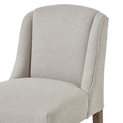Grey upholstered Bristol Aspen dining chair by Dine and Dwell with wooden legs, featuring a modern and comfortable design.