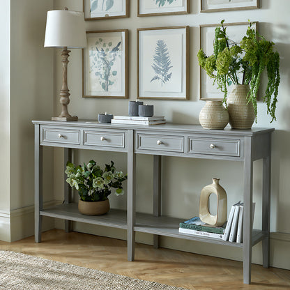 Dine and Dwell Ledbury grey distressed wood sideboard with four drawers, sleek console table for dining or living room decor.