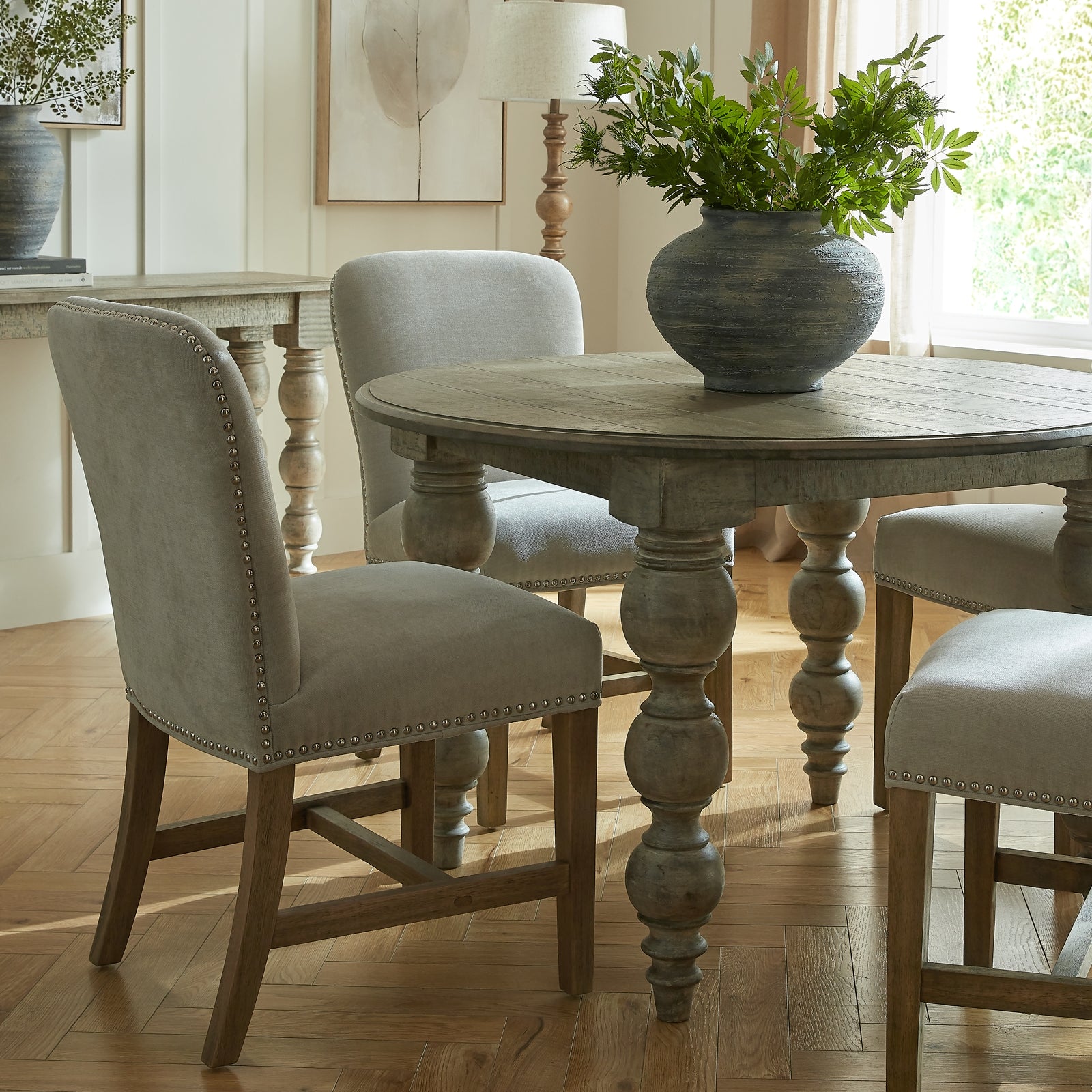 Brown Dine and Dwell St Ives round wooden dining table with smooth surface and sturdy legs, ideal for kitchen or dining room use.