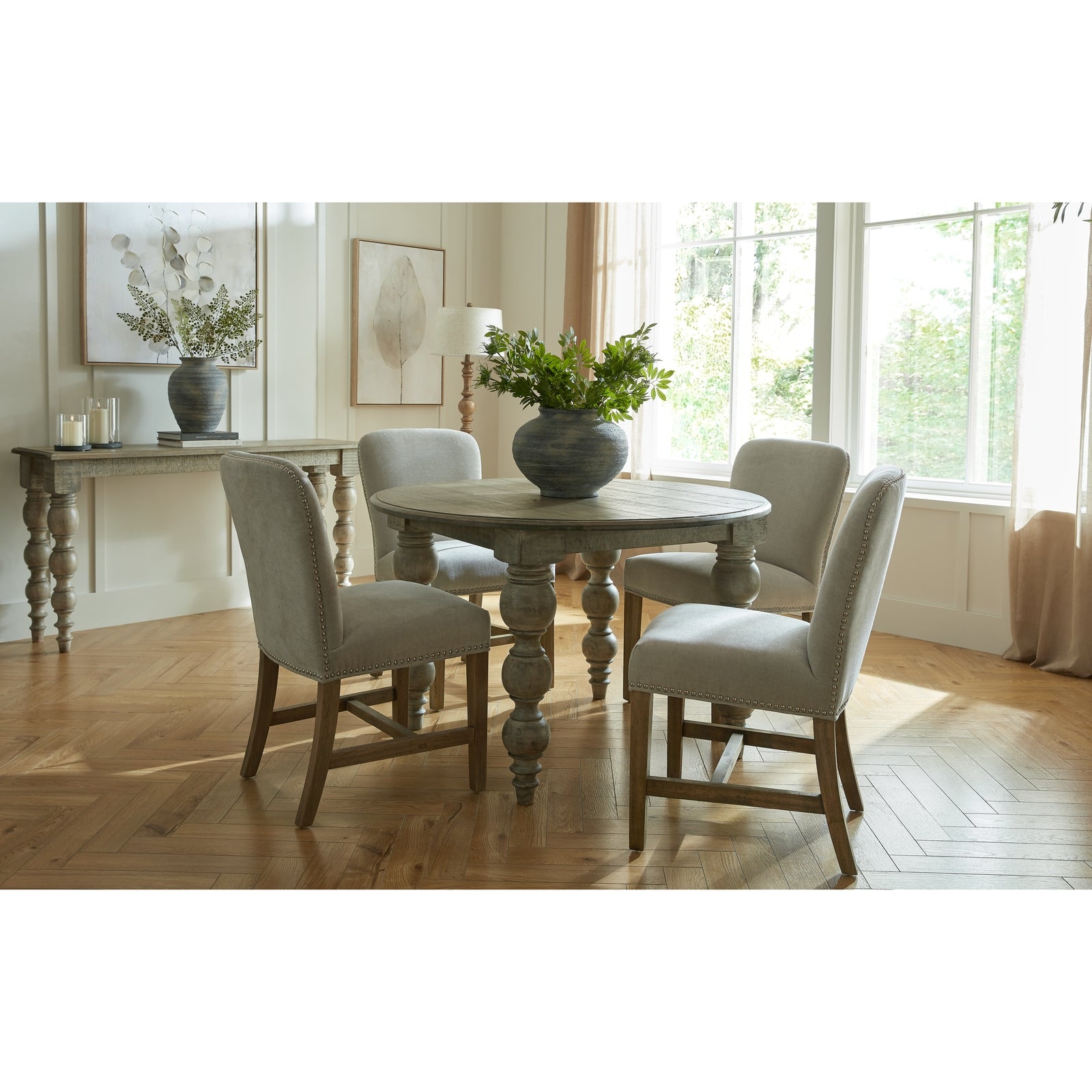 Brown wood Dine and Dwell St Ives round dining table with smooth surface and sturdy legs for family meals and gatherings.