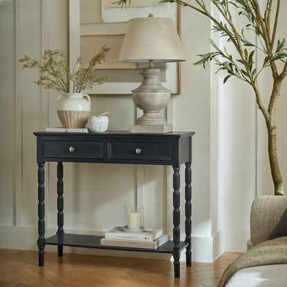Black wood Dine and Dwell Bidbury 2-drawer console table, a stylish sideboard with modern design and functional storage.
