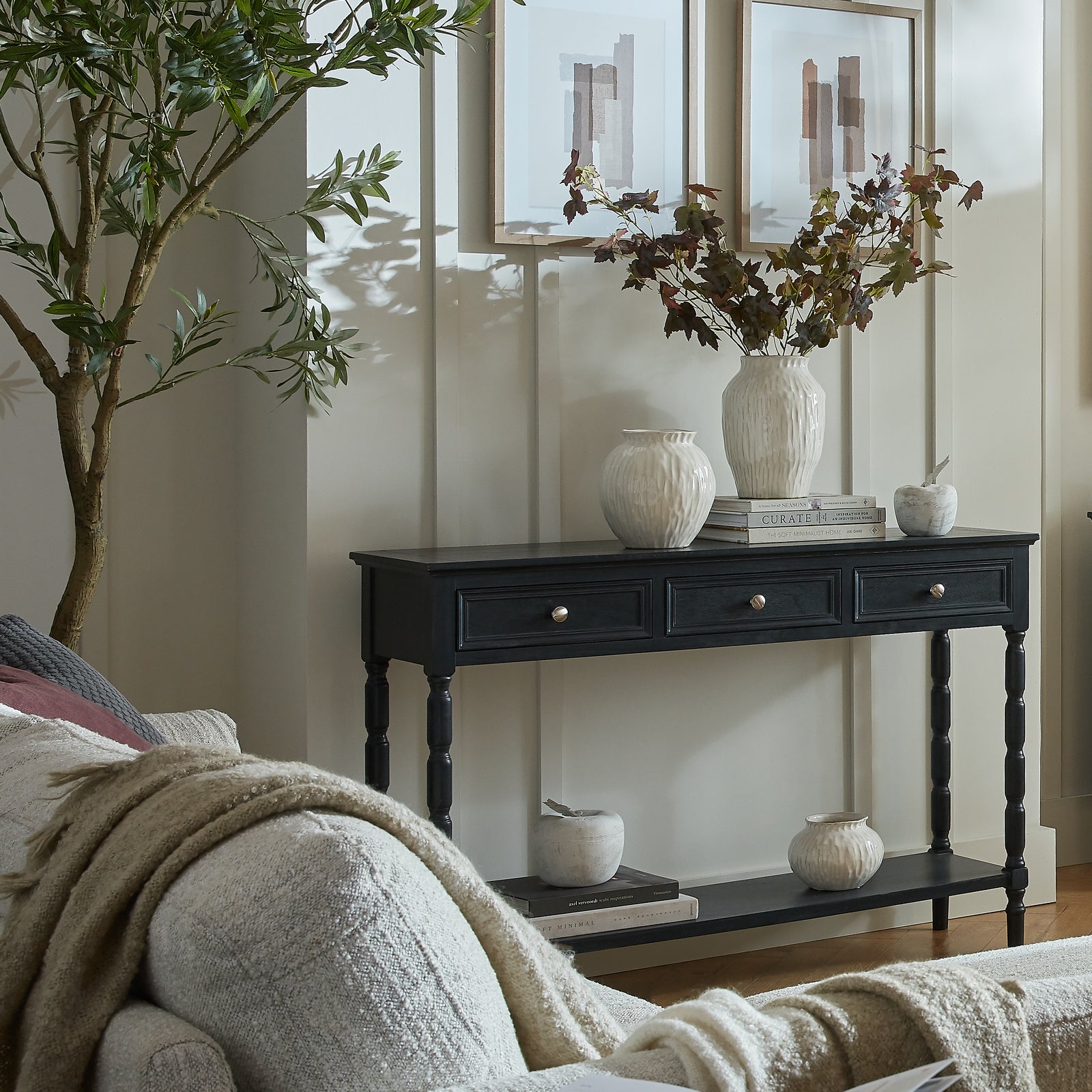 Black wood Dine and Dwell Bidbury sideboard with three drawers and sleek design, perfect for modern living spaces.