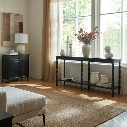 Black wood Dine and Dwell Bidbury large console sideboard with sleek design and spacious surface for storage and display.