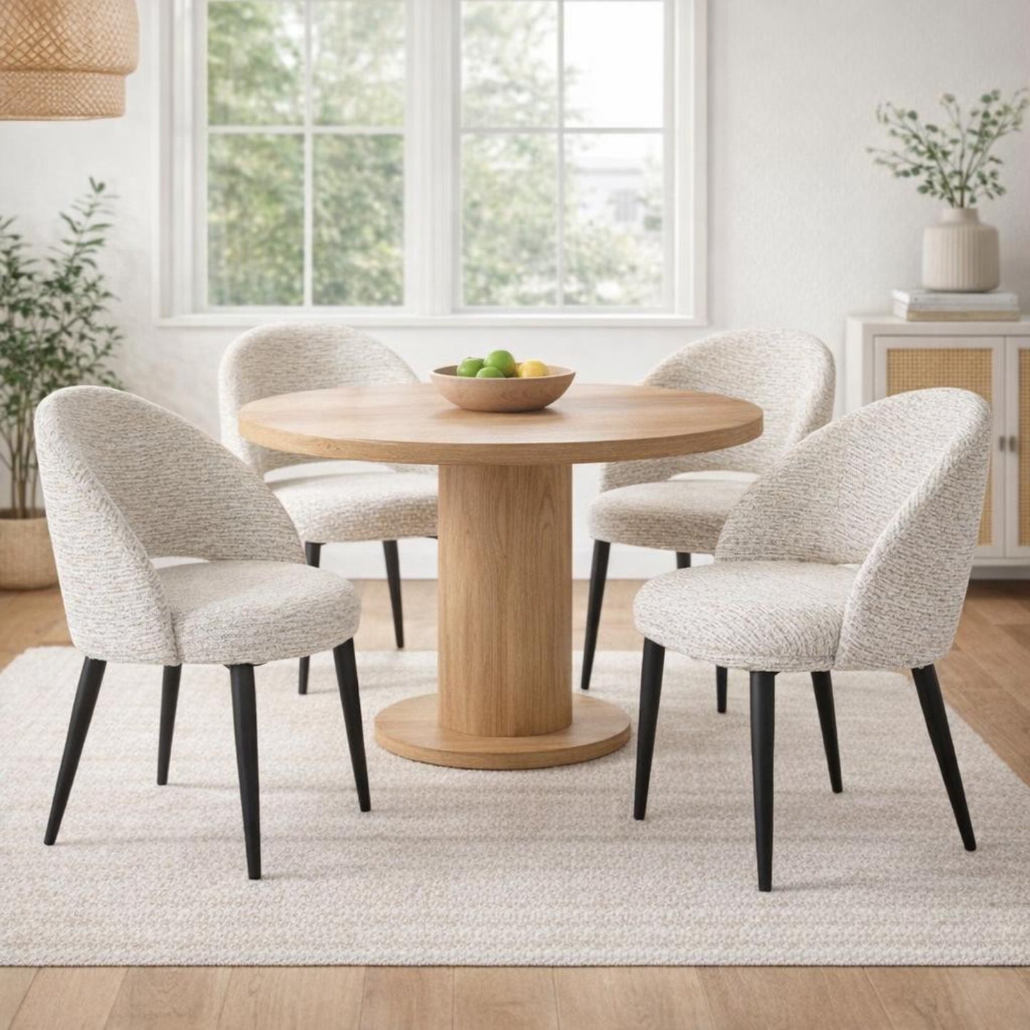White upholstered Dine and Dwell Sandwell curved dining chair with black metal legs, stylish and modern for dining rooms.