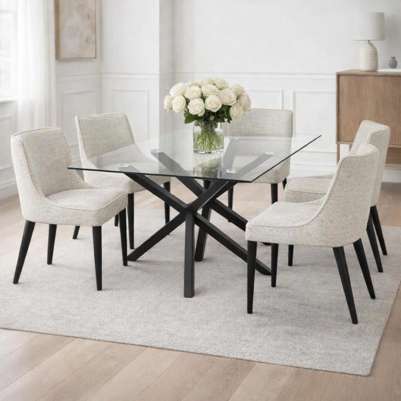 Dine and Dwell Stourbridge rectangular dining table with glass top and black metal legs, modern and stylish for dining rooms.