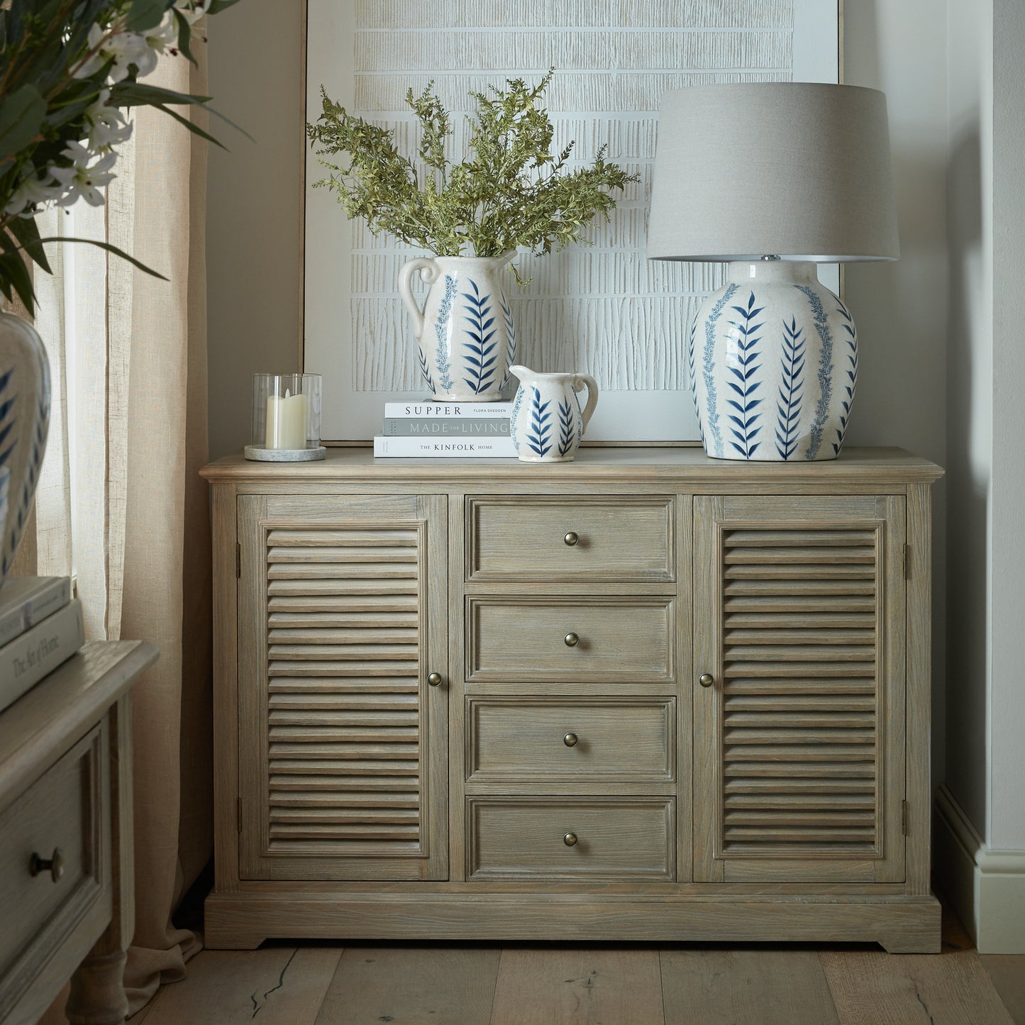 Dine and Dwell Leamington large brown wood sideboard with two doors and four drawers, ideal for living or dining room storage.
