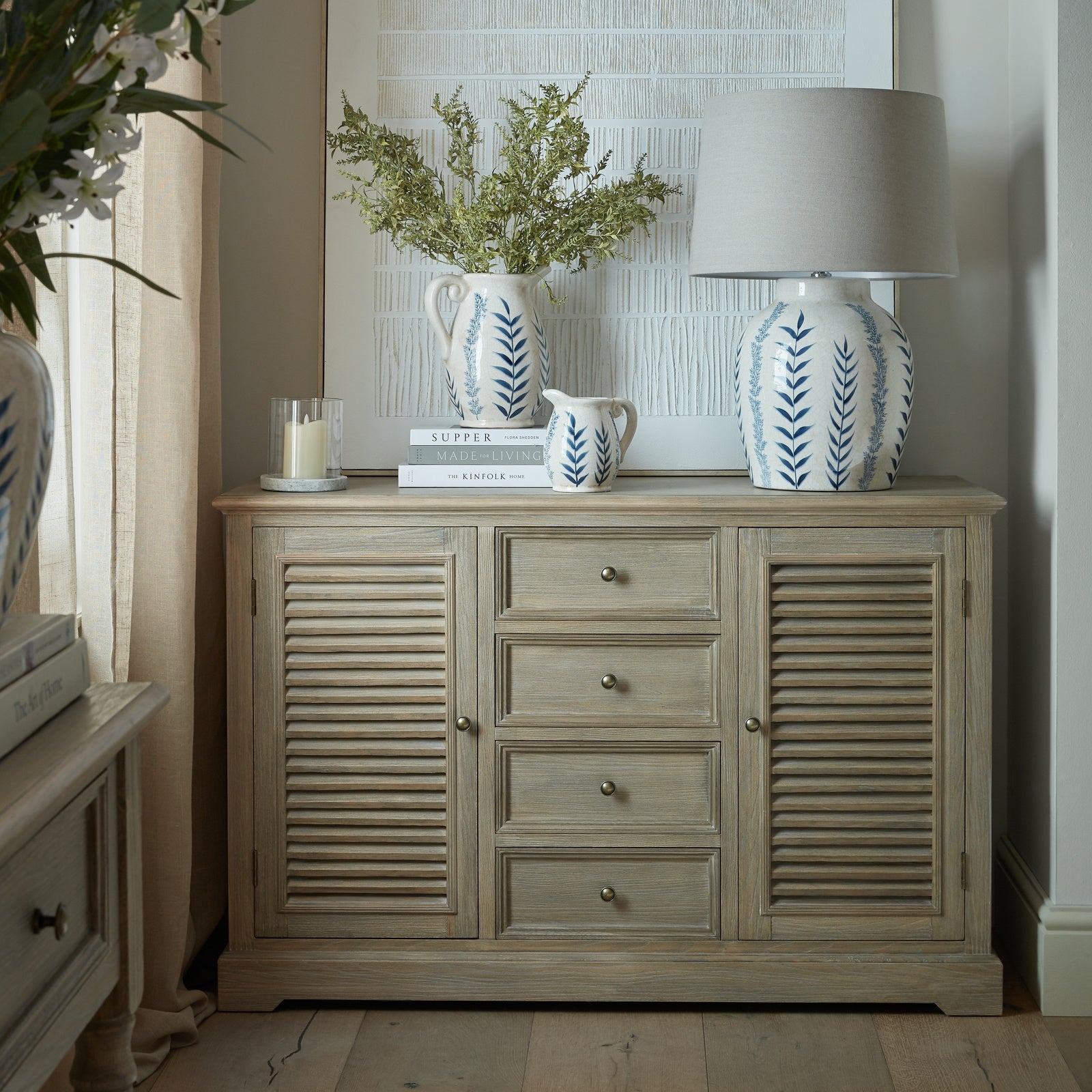 Dine and Dwell Leamington large brown wood sideboard with two doors and four drawers, ideal for living or dining room storage.